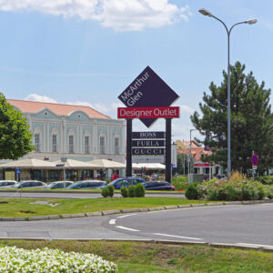 53811619 - parndorf, austria - july 10, 2015: mcarthur glen designer outlet in parndorf. famous discount shopping village near vienna.